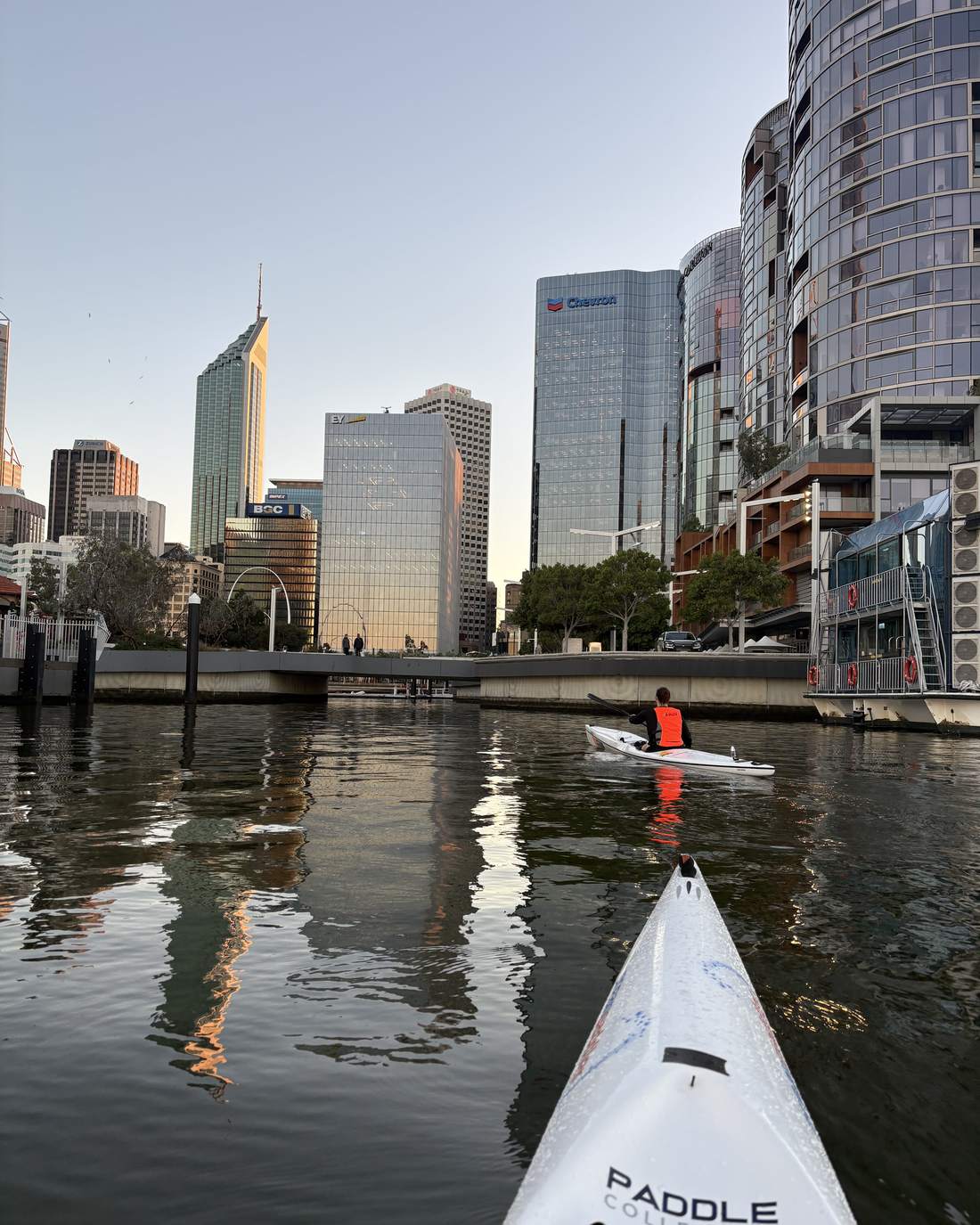 Bow of a ski on the river in front of the city